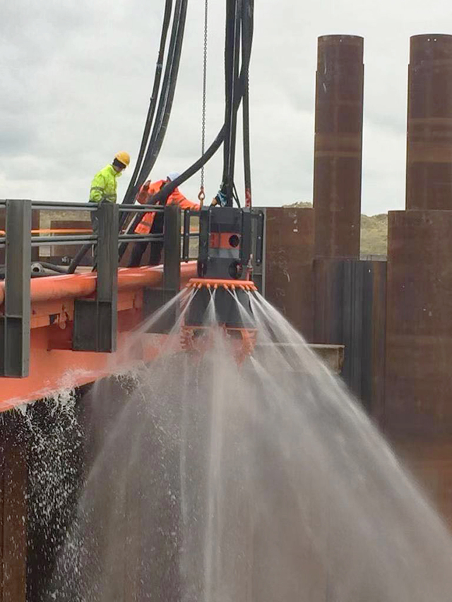 Dual action pile excavating and cleaning tool for marine applications