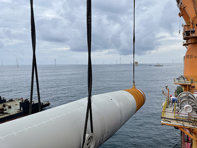 The mono pile is lifted from the transport vessel and upended