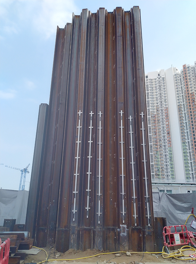 Sheet pile tuned mass damper for construction noise control