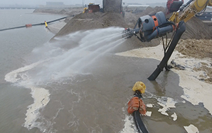 Land reclamation and harbor excavation by dredge pump