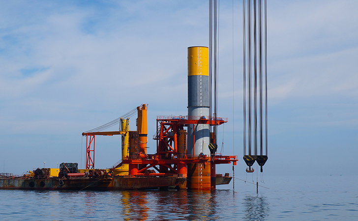 Four-legged frame positions mono piles at Liaoning Province Offshore Windfarm